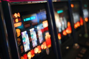 Gaming machine surrender to relieve debt